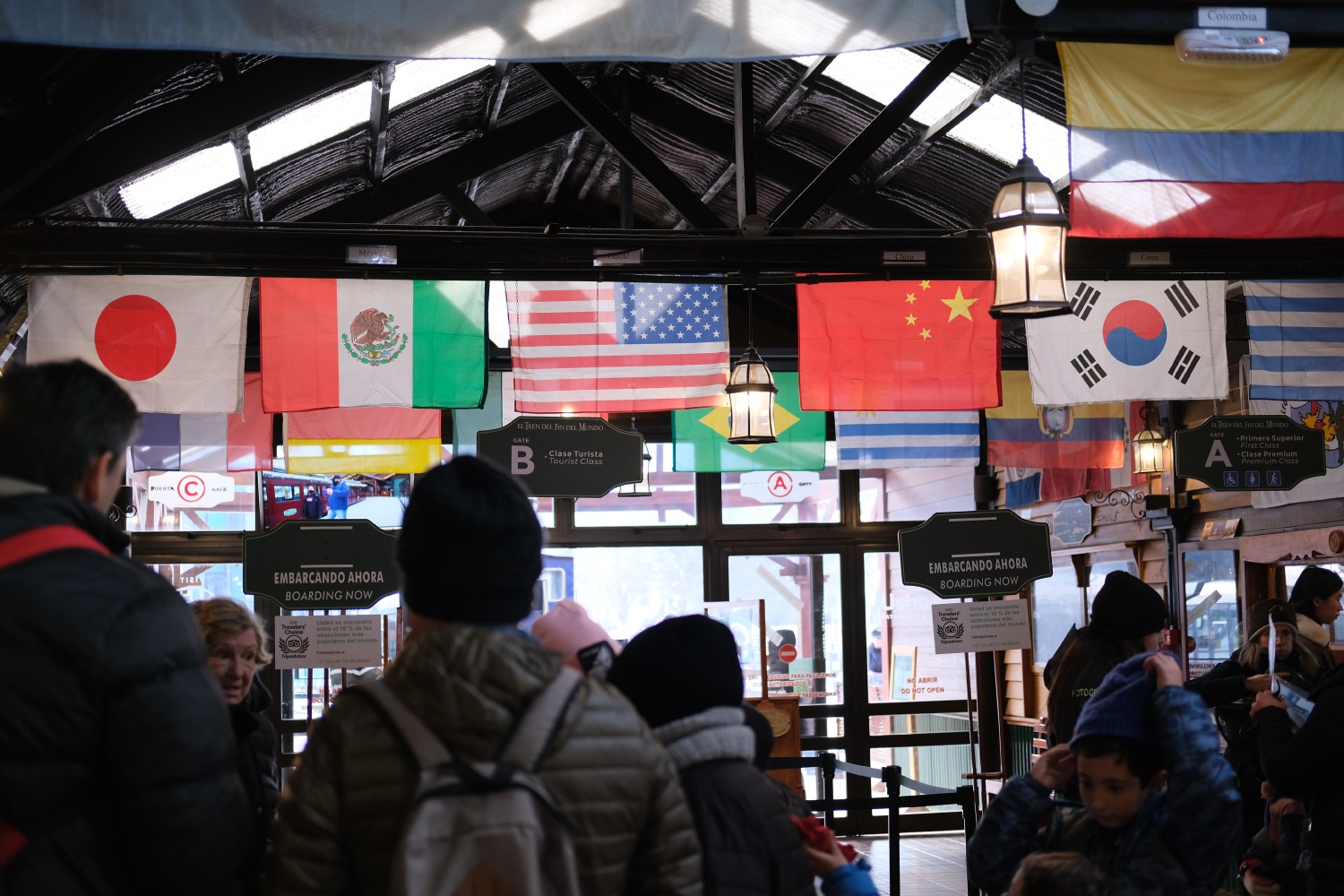 Flags decorate the train station *at the end of the world*