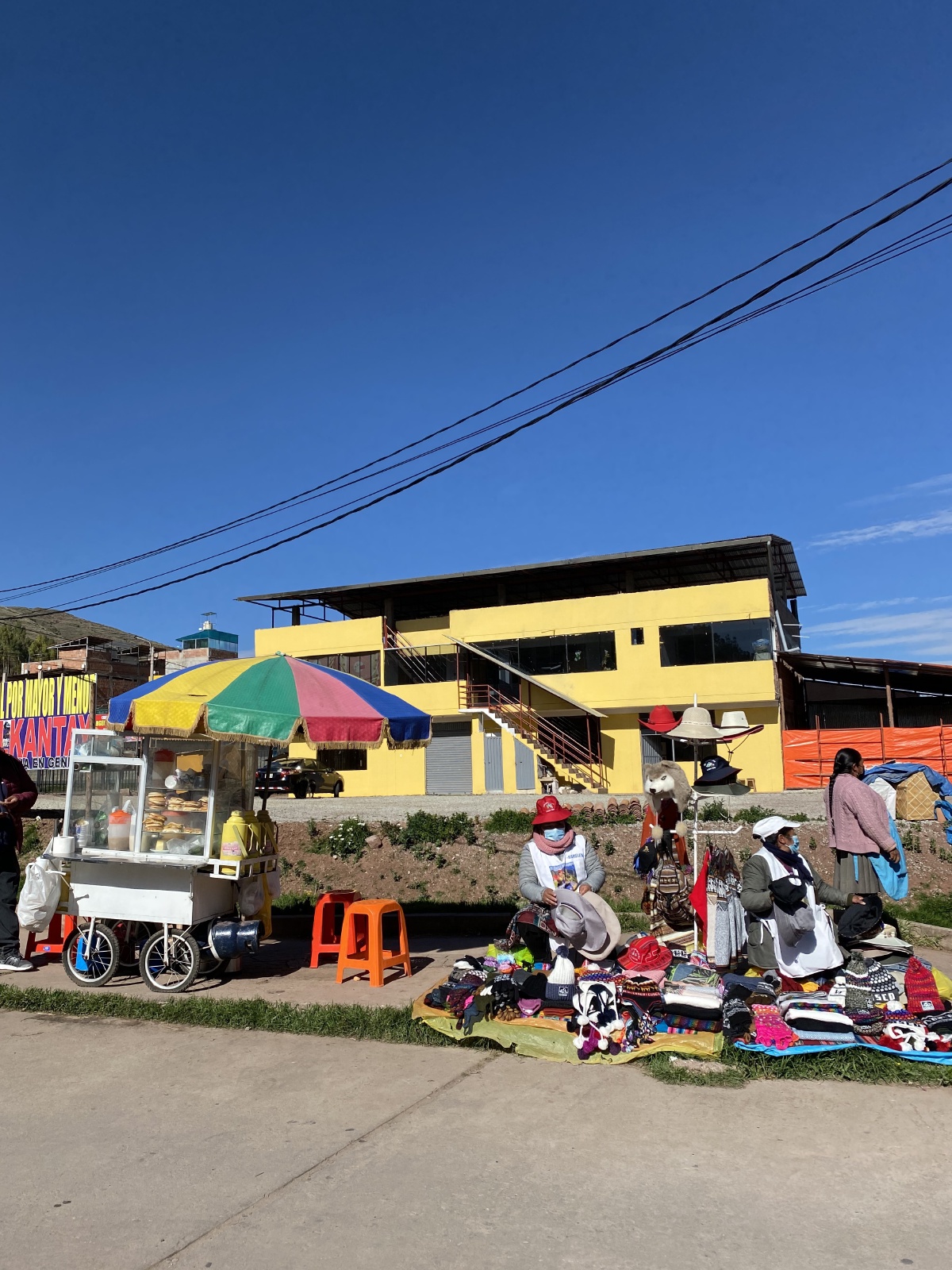 We were reminded that we need to have faceshields on the entire train ride to Machu Picchu - went out the Poroy Train station, and these ladies were selling them, plus beanies and some snacks, too!