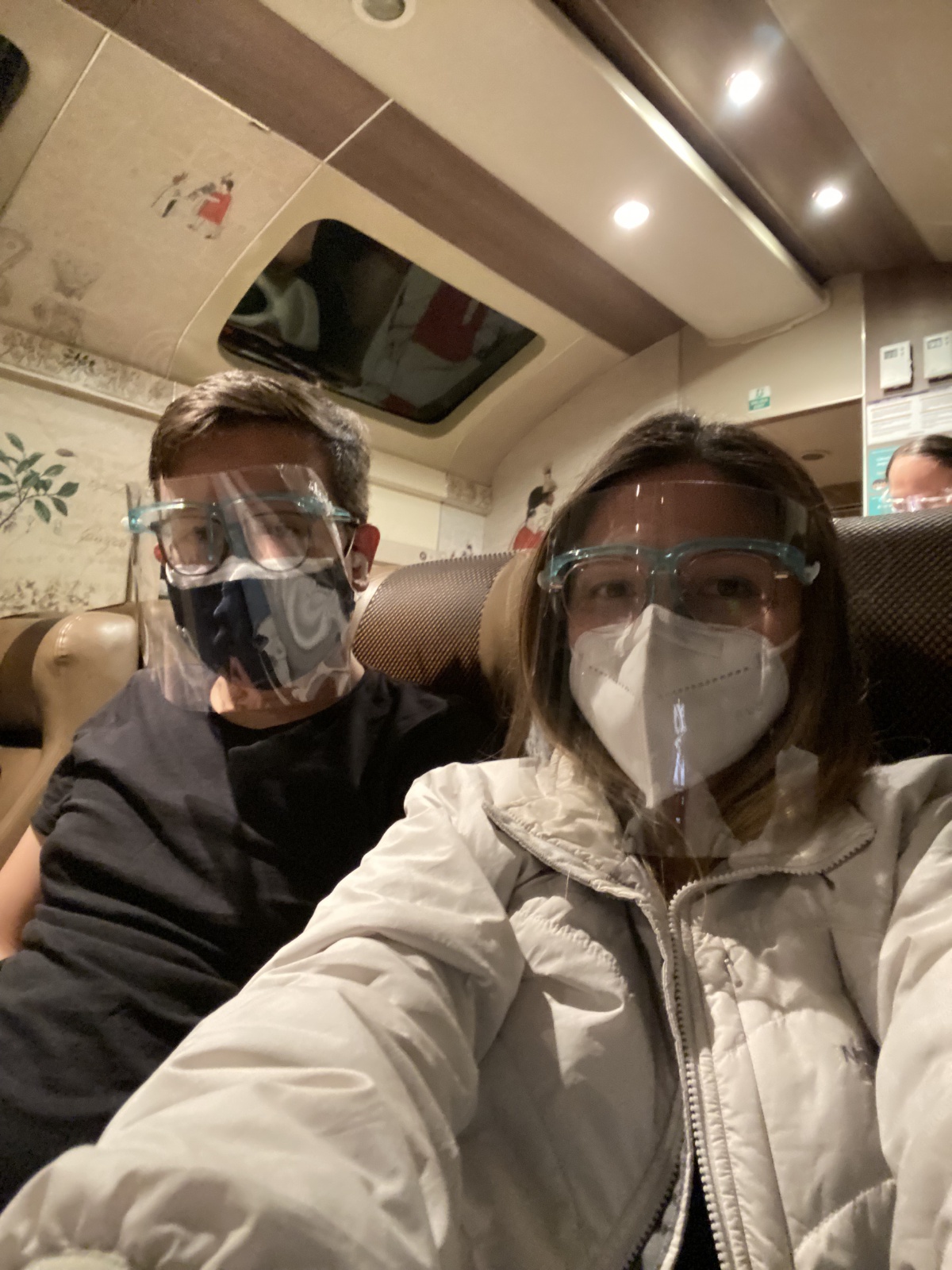 We made it! It's already dark and most of the people on the train are also pooped! Time for our faceshields and mask combo.