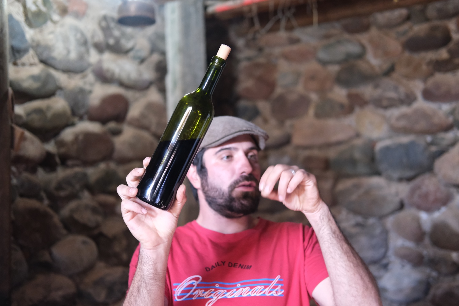 His are natural wines, meaning he doesn't add or use any chemicals in his vineyards and winemaking process. Here he explains that sediment marks on the bottle are natural.