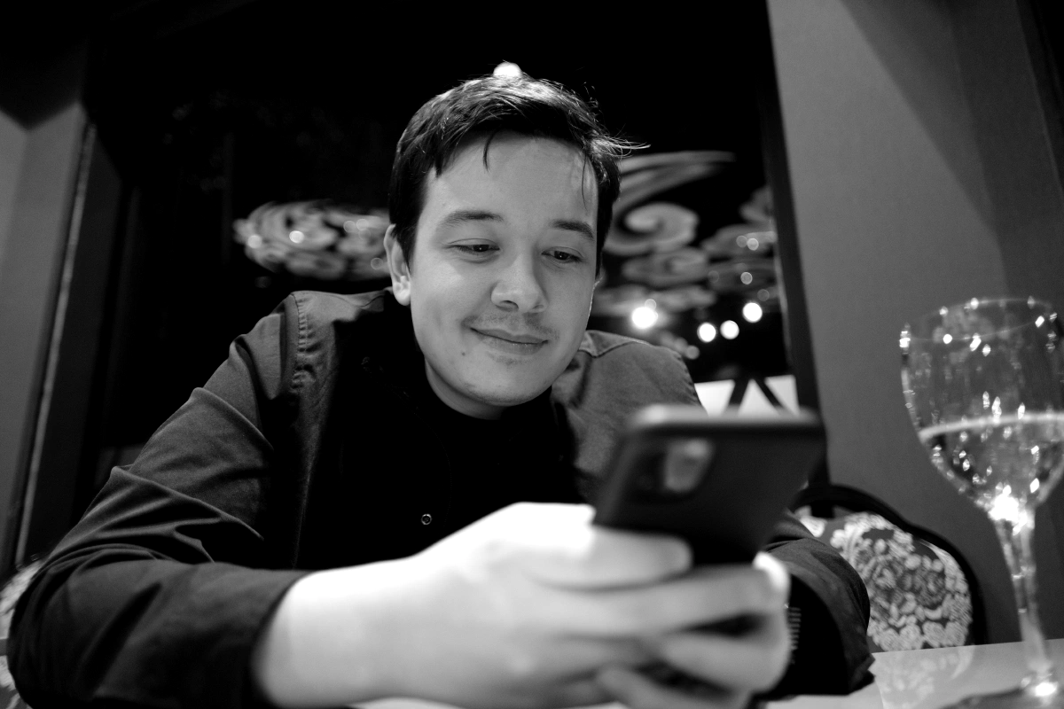 What is he doing? Looking up places to go to in Ushuaia? Memes?