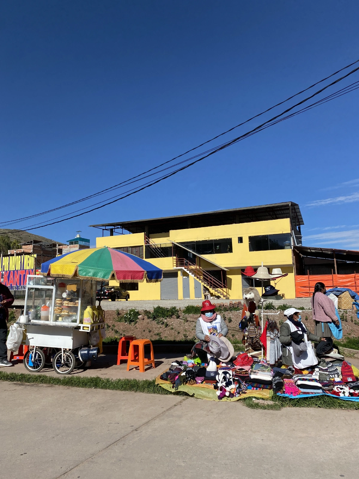 We were reminded that we need to have faceshields on the entire train ride to Machu Picchu - went out the Poroy Train station, and these ladies were selling them, plus beanies and some snacks, too!