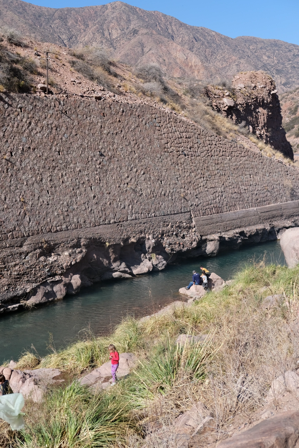 People hanging out by the river