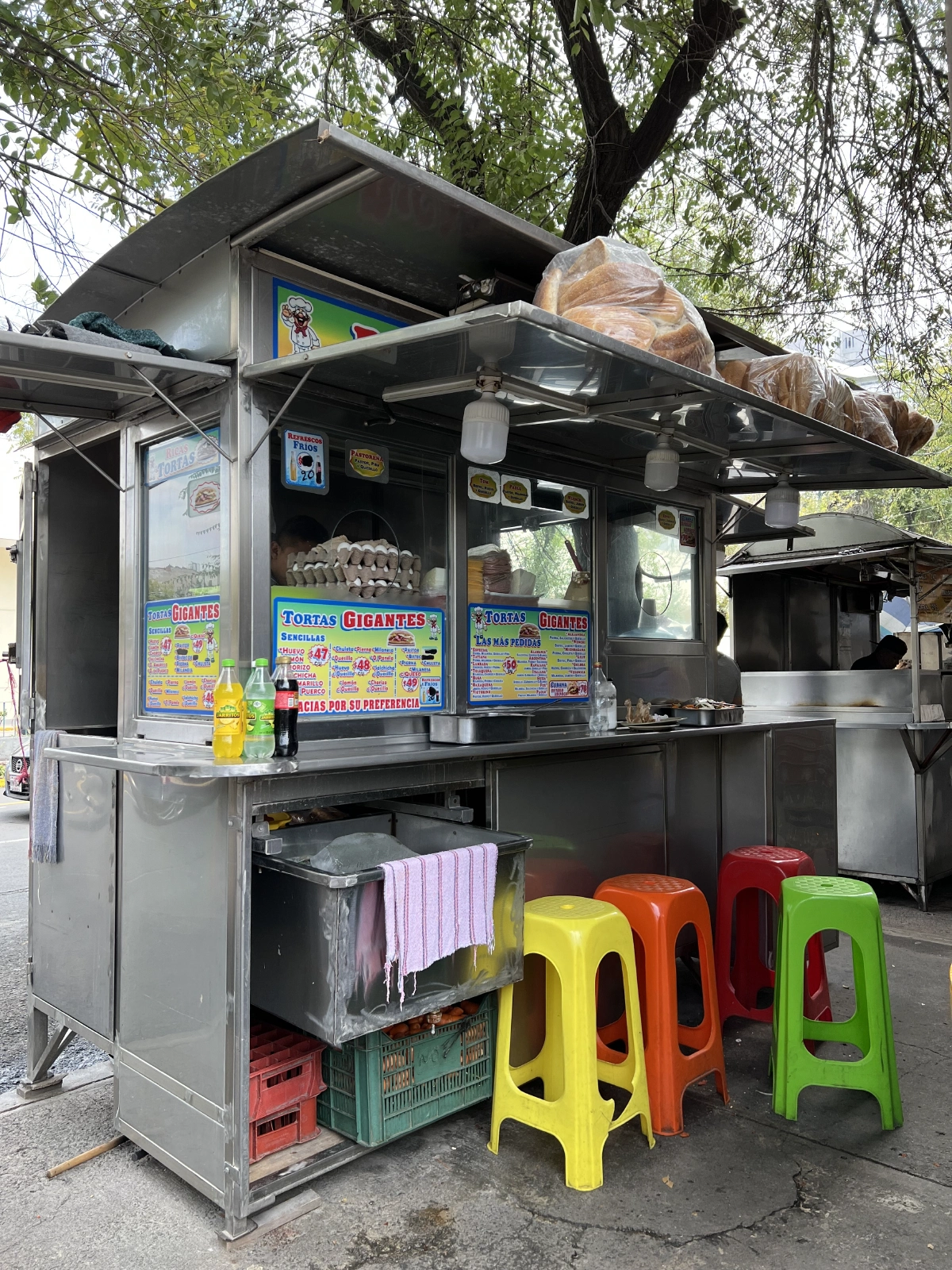 Food stalls outside the grocery store.. Reminds me of East Ave.