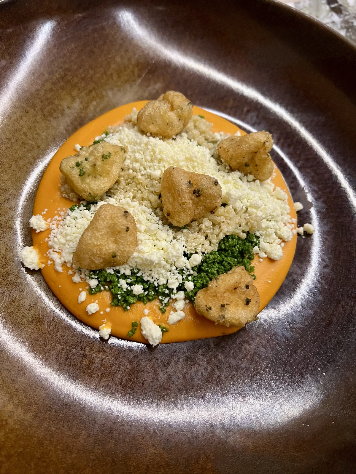 Huauzontles with Chiapas Cuadro Cheese, amaranth and tomato ragout.